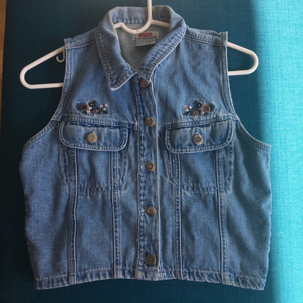 Cropped blue jean vest.